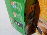 two boxes of legos sitting next to each other on a table