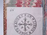 an old book with a picture of a compass on it