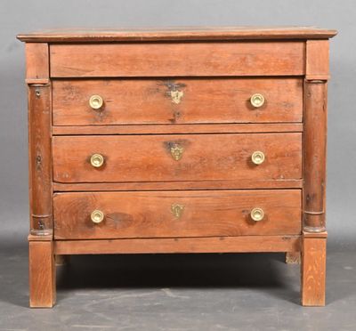 an old wooden chest of drawers with brass handles