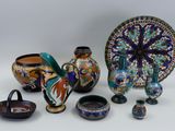 many different types of vases and bowls on the table