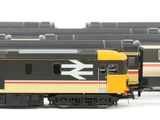three trains that are lined up on the tracks