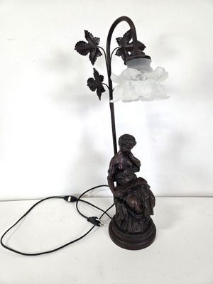 an image of a lamp that is on a table next to a lamp