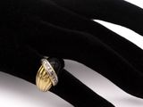 an image of a close up of a person ' s hand with a ring on it