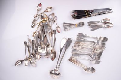 a lot of silverware and a pen on a table