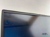 a laptop computer sitting on top of a desk