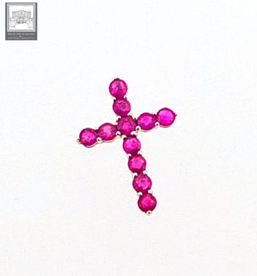 une croix composée de pierres roses sur un fond blanc