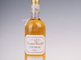 an image of a bottle of liquor sitting on a table