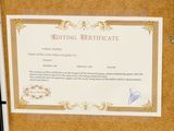 a picture of a certificate on a bulletin board