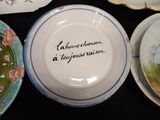 a plate with a quote on it sitting on a table