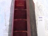 an old book that is sitting on a table