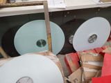 a pile of cds and other items in a room