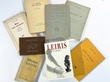 a pile of books that are sitting on a table