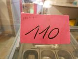 a sign that says $ 10 on it in front of a display case