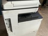 a printer that is sitting on top of another printer