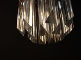 a light that is hanging from the ceiling in the dark