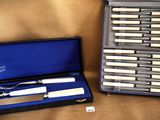 a case with a knife and a knife set in it