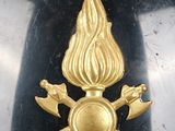 a gold fire hydrant on a black table