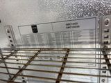 a metal rack with a lot of items on it