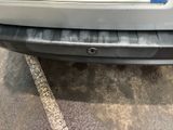 a close up of a car ' s bumper with a sticker on it