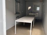 a table in the middle of a room that is empty