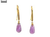 a pair of earrings with amethorate and gold
