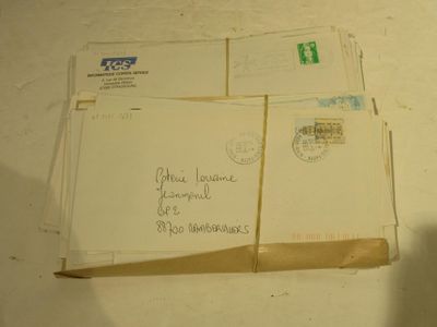 a stack of letters sitting on top of a table