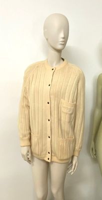 two mannequins are standing next to each other in front of a white wall