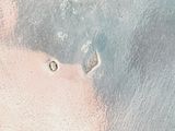 a close up view of a frosty surface with water droplets