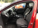 a red car with black seats in the back of it