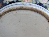 a vase that has a blue and white design on it