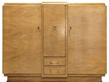 a wooden cabinet with two doors and drawers on top of it