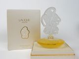 an image of a bottle of perfume sitting on top of a box