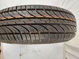 a close up of a tire on a white surface