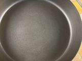 a frying pan sitting on a stove top on a table