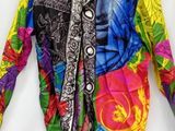 multicolored jacket on a hanger on a white background