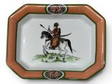 a picture of a plate with a picture of a man on a horse
