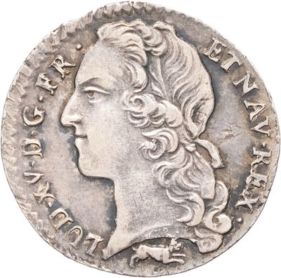 gros plan d'une pièce de monnaie sur laquelle figure un visage de femme