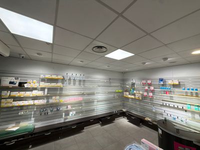 many shelves in the store that are empty of people