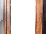 a large mirror sitting on top of a wooden cabinet