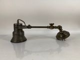 an old fashioned lamp on a white surface with a white background