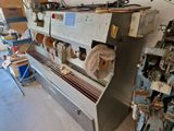 a machine that is sitting in a room with a lot of tools