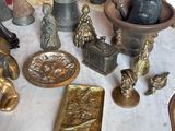 a table with a bunch of antique items on it