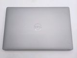 dell laptop computer sitting on top of a table with a white background