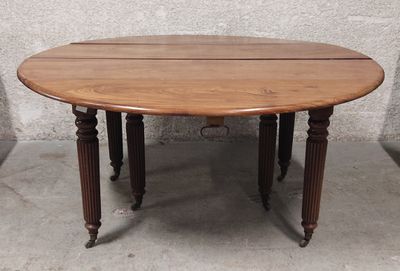 a wooden table with two legs and a wooden top