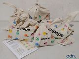 three bags with different designs on them on a table