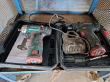 two power tools in the case on the floor