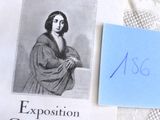 un livre sur lequel figure la photo d'une femme à côté d'un morceau de papier bleu