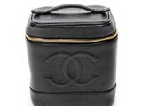 a close up of a black leather case with a logo on it