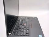a laptop with a black keyboard on a white surface