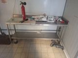 a table with a fire extinguisher next to a fire hydrant
